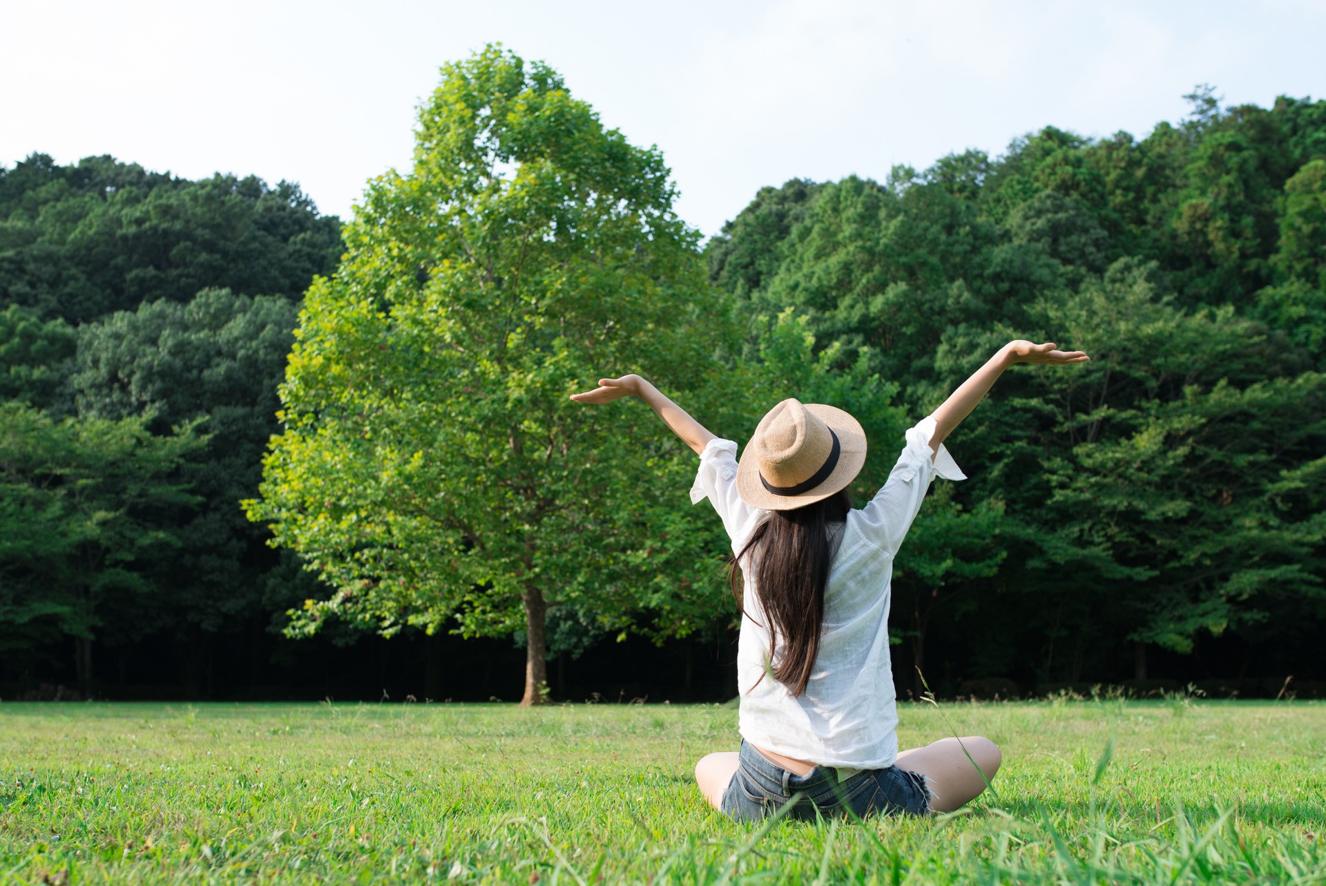 Woman relaxing in a lawn